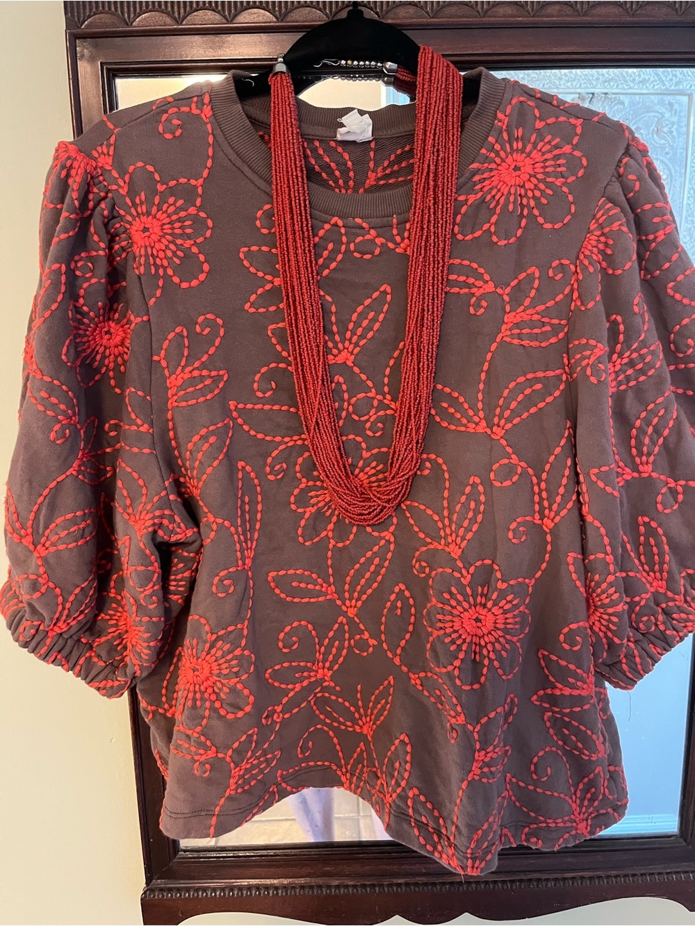 Ivy Jane Brown top with orange floral vines embroidery.